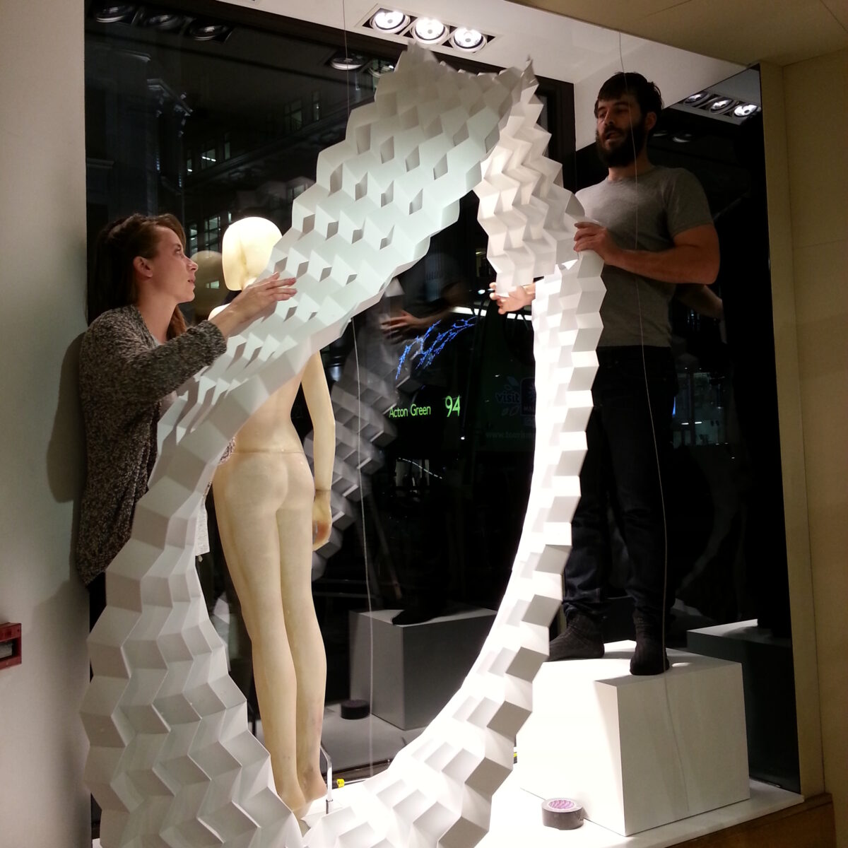 Kate Rider and Ed Grainge installing the Karen Millen Xmas Window Display ©Mamou-Mani