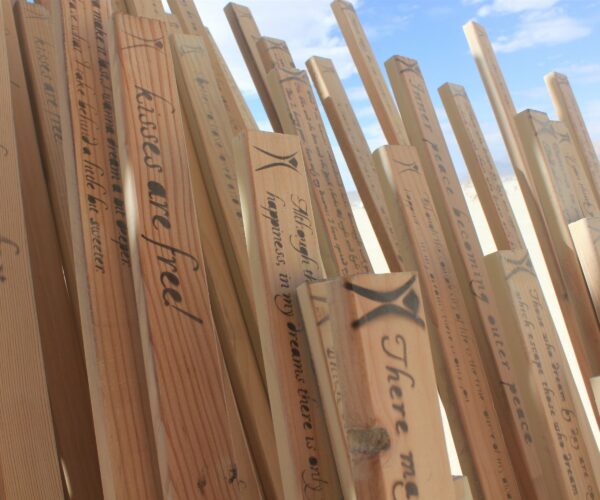 Tangential Dreams at Burning Man 2016 - Close-Up on the Tangents, stenciled with inspiring sentences ©Mamou-Mani